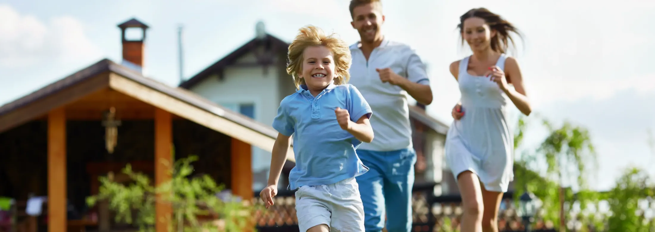 family running on lawn